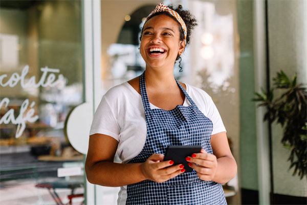 Image of a businessowner in front of her store
