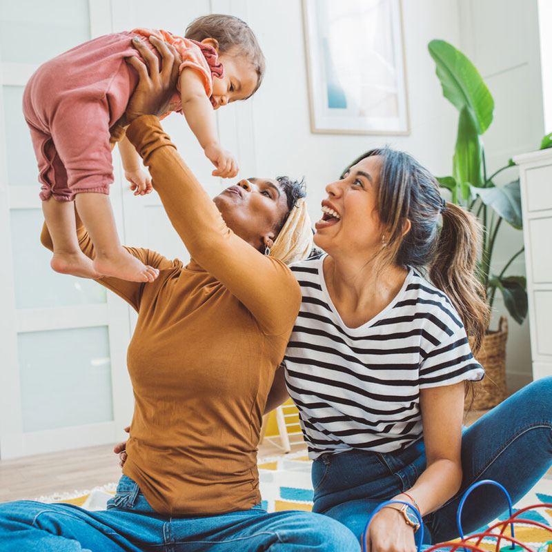 Image of a couple holding their baby