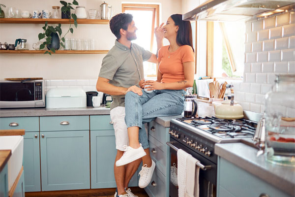 Image of a happy couple in their kitchen