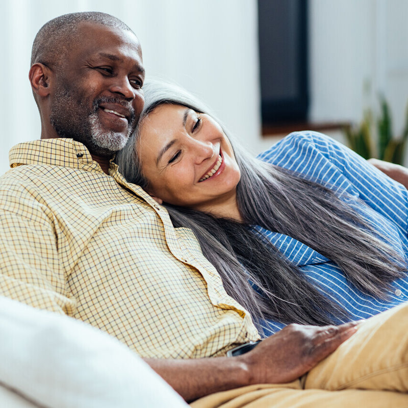 Image of an elderly couple hugging