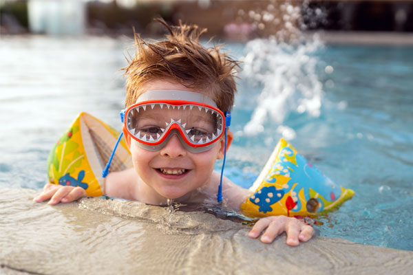 Image of a happy child swimming