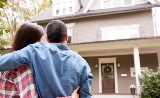 Couple looking at their newly purchased home