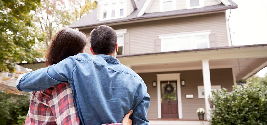 Couple looking at their newly purchased home