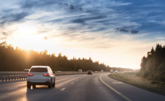 Car driving on the highway at sunset