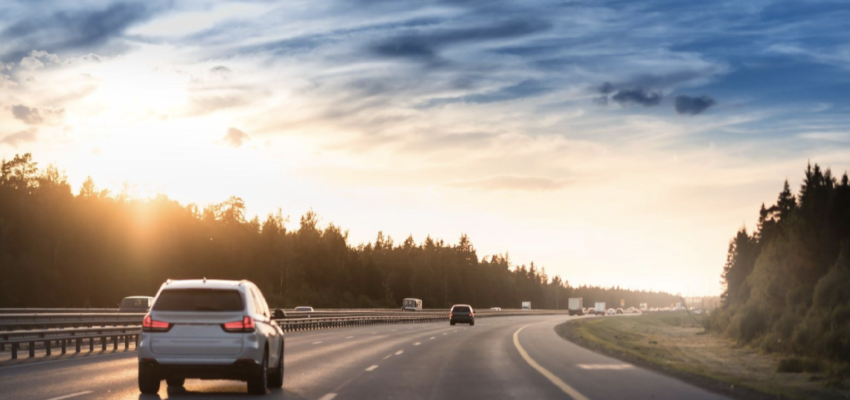 Car driving on the highway at sunset