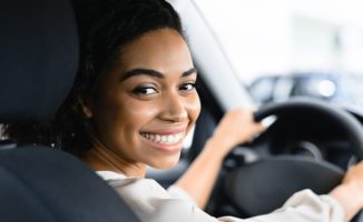 women driving her new car and car insurance