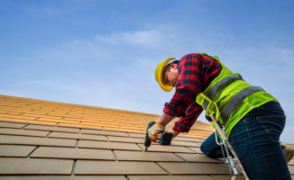 person fixing roof