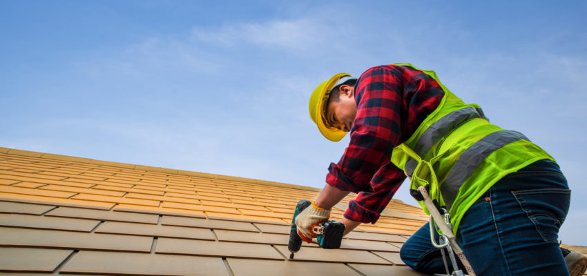 person fixing roof