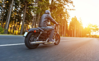 Motorcycle on tree lined street